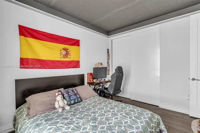 bedroom with hardwood / wood-style flooring