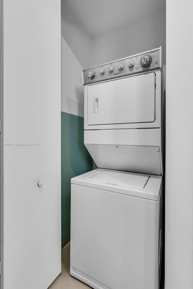 laundry room featuring stacked washer and clothes dryer