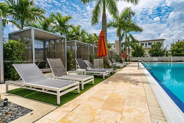 view of swimming pool with a patio