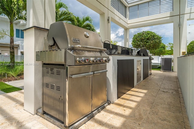 view of patio / terrace with grilling area and an outdoor kitchen