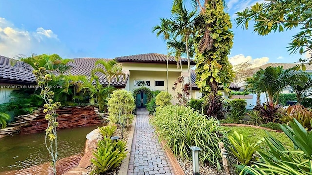 view of front of property with a water view