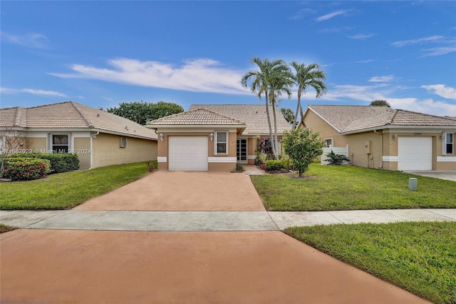 view of front of home with a garage and a front yard