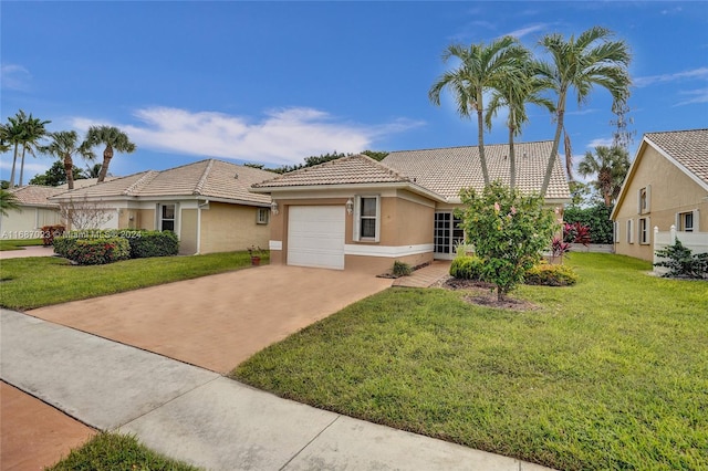 view of front of property featuring a garage and a front lawn