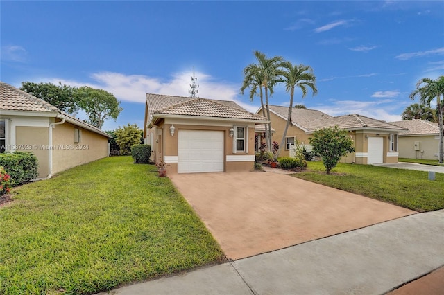 view of front of house featuring a garage and a front lawn