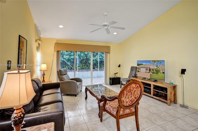 tiled living room featuring ceiling fan and lofted ceiling