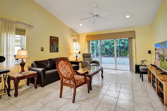 living room with ceiling fan, light tile patterned floors, and high vaulted ceiling