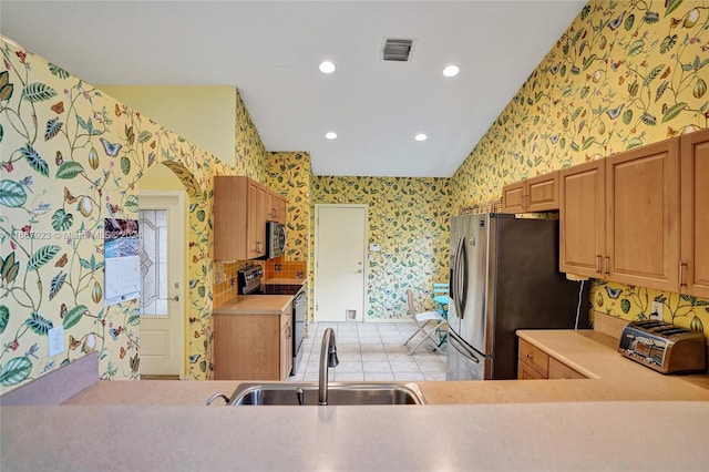 kitchen featuring stainless steel appliances and sink