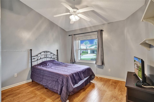 bedroom with ceiling fan and light wood-type flooring