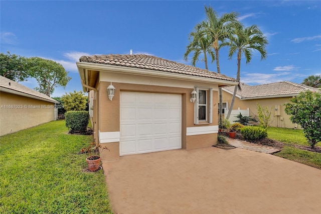 mediterranean / spanish house featuring a garage and a front yard