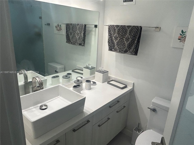 bathroom with vanity and toilet