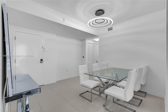 dining space featuring light tile patterned floors