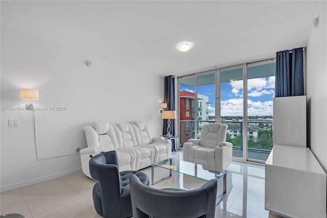 tiled living room featuring floor to ceiling windows