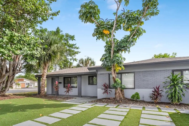 view of front of home with a front lawn