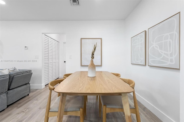 dining room featuring light hardwood / wood-style flooring