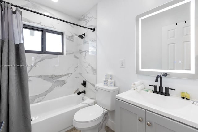 full bathroom with vanity, shower / tub combo, and toilet