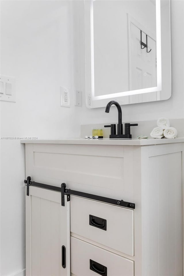 interior details with a barn door and sink