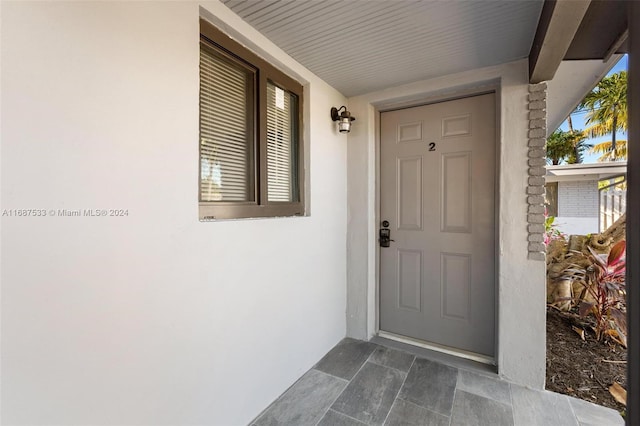 doorway to property featuring covered porch