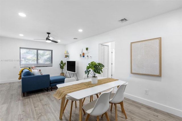 dining area featuring ceiling fan and light hardwood / wood-style flooring