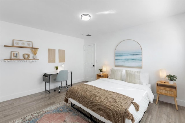 bedroom with light hardwood / wood-style floors