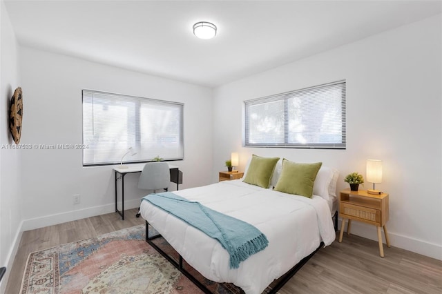 bedroom with light wood-type flooring