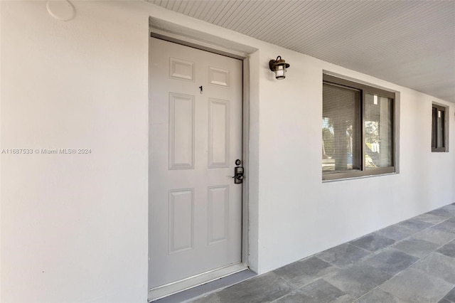 doorway to property featuring covered porch