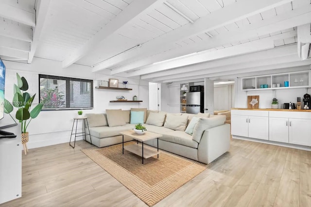 living room with light hardwood / wood-style floors, beamed ceiling, and wooden ceiling