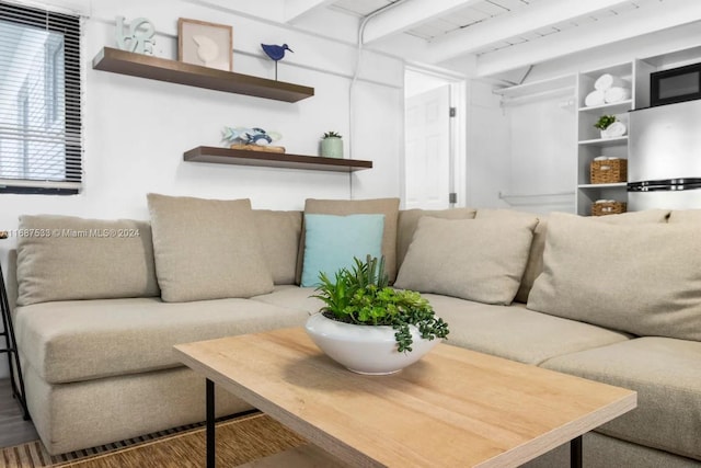 living room with beamed ceiling and hardwood / wood-style flooring