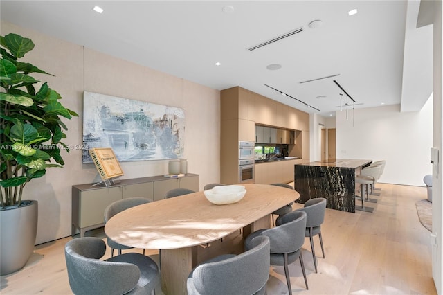 dining room with light wood-type flooring