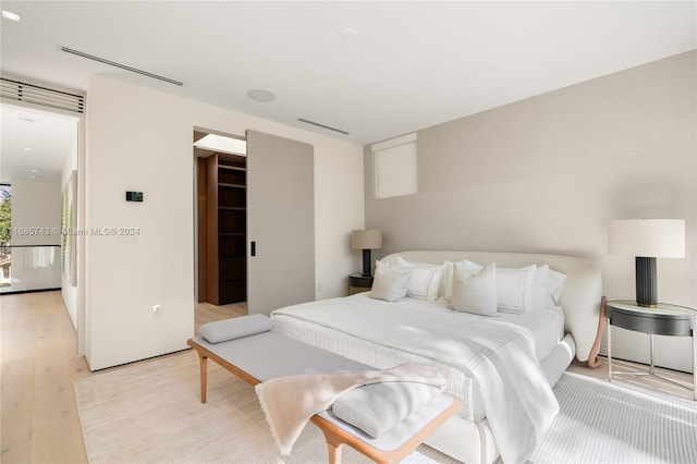 bedroom with light hardwood / wood-style floors