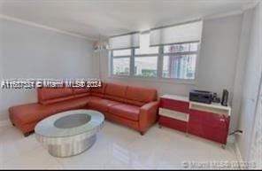 living room with ornamental molding