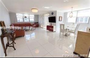 living room featuring light tile patterned flooring