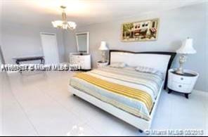 1833 S Ocean Dr Unit Ph1, Hallandale Beach, FL 33009 - bedroom featuring a chandelier