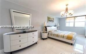 bedroom with an inviting chandelier