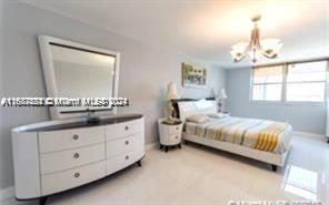 1833 S Ocean Dr Unit Ph1, Hallandale Beach, FL 33009 - bedroom with a chandelier and baseboards