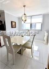 dining area featuring tile patterned flooring