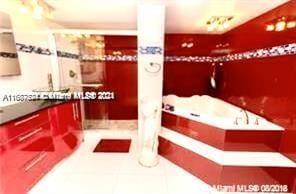 1833 S Ocean Dr Unit Ph1, Hallandale Beach, FL 33009 - bathroom featuring a garden tub and vanity