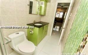 1833 S Ocean Dr Unit Ph1, Hallandale Beach, FL 33009 - full bathroom featuring vanity and tile patterned flooring