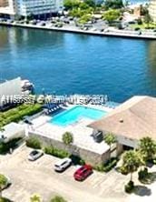 birds eye view of property with a water view