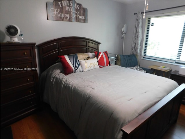 bedroom with wood finished floors