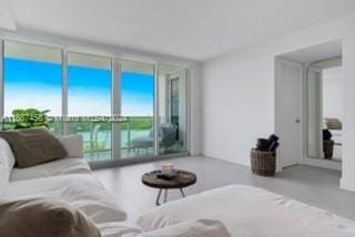 living room featuring floor to ceiling windows