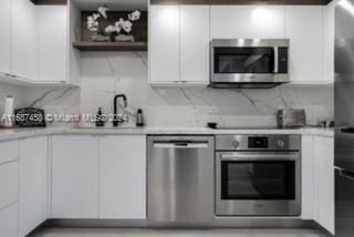 kitchen with white cabinets and stainless steel appliances