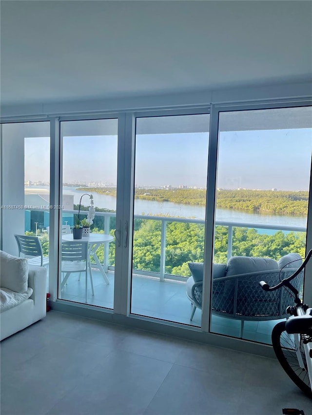 entryway featuring concrete flooring and a water view