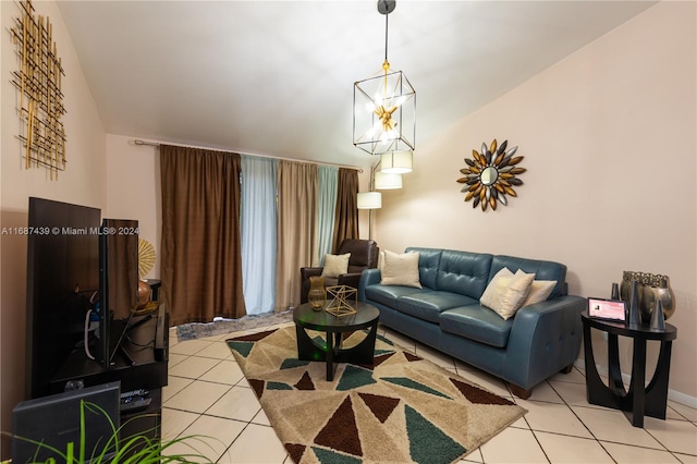 tiled living room featuring an inviting chandelier