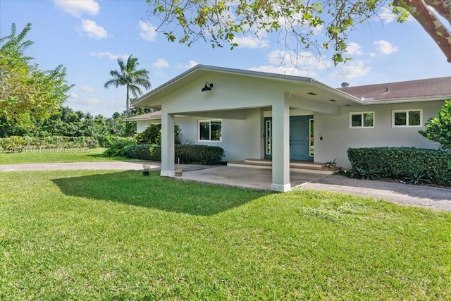 back of house with a yard