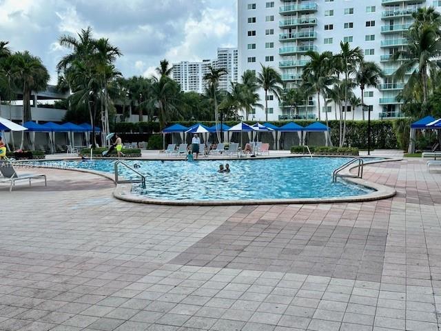 19370 Collins Ave Unit 1203, Sunny Isles Beach, FL 33160 - community pool with a patio area
