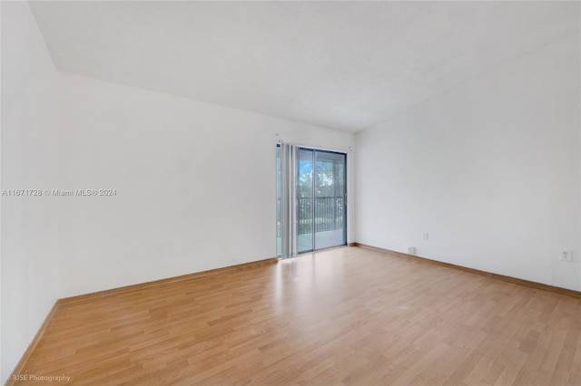 spare room with light wood-type flooring