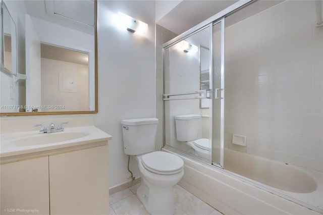 full bathroom with toilet, combined bath / shower with glass door, vanity, and tile patterned flooring