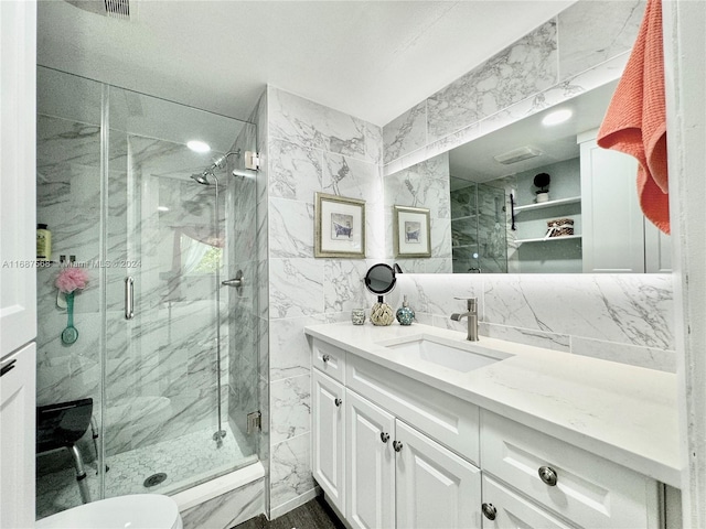 bathroom featuring backsplash, an enclosed shower, toilet, tile walls, and vanity