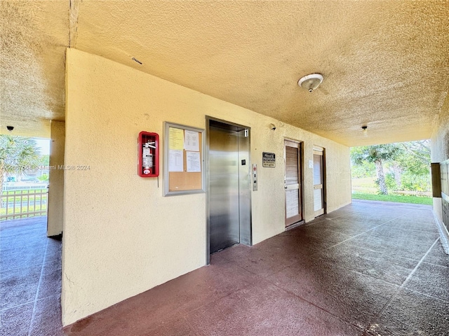 hallway featuring elevator