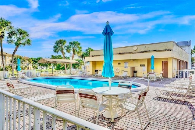 view of swimming pool featuring a patio area